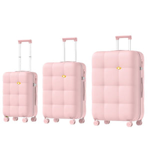 Set of three pink suitcases of different sizes on a white background