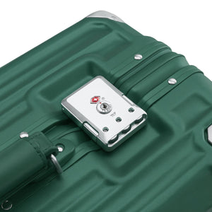 Close-up of a dark green suitcase showing its silver TSA combination lock and textured hard-shell design.