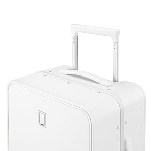 Close-up of the white suitcase top carry handle and telescopic trolley frame.