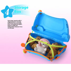 Open blue BabyYuga suitcase showing toys secured with green X-shaped straps, displaying its storage capacity.