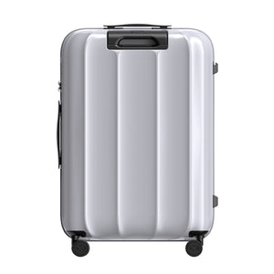 Silver suitcase with black wheels on a white background