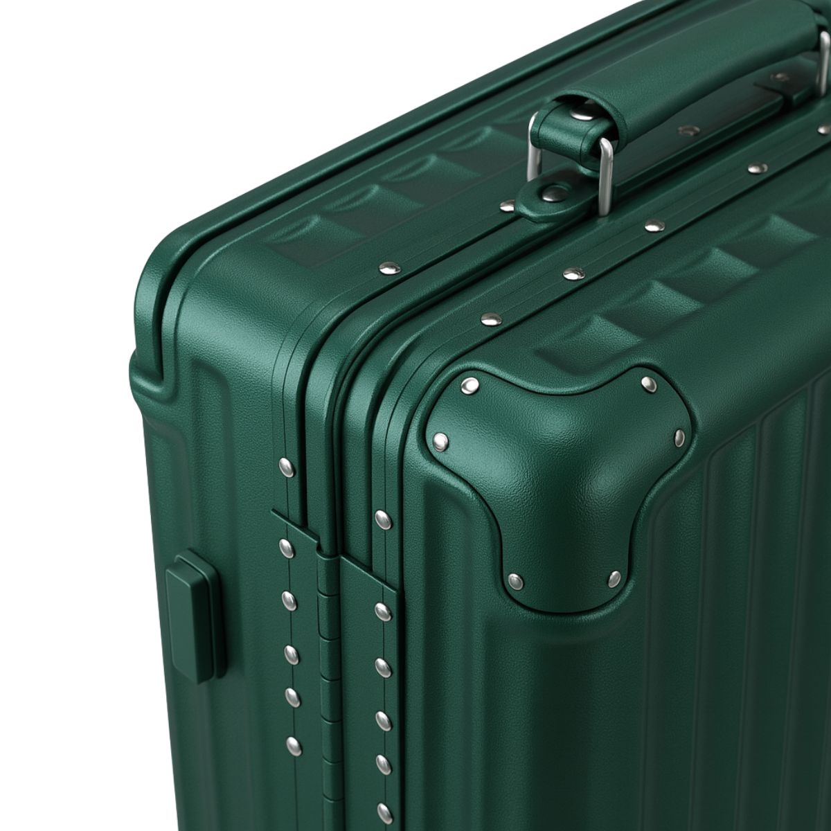 Close-up of a dark green hard-shell suitcase showing reinforced aluminum corners, rivet details, and a top carry handle.