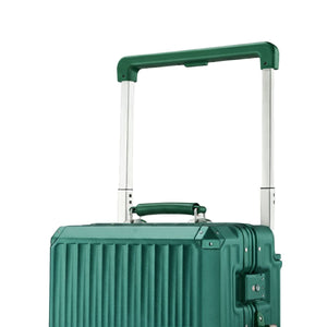 Close-up of a dark green suitcase showing its telescopic handle, top carry handle, and vertical hard-shell ridge design.