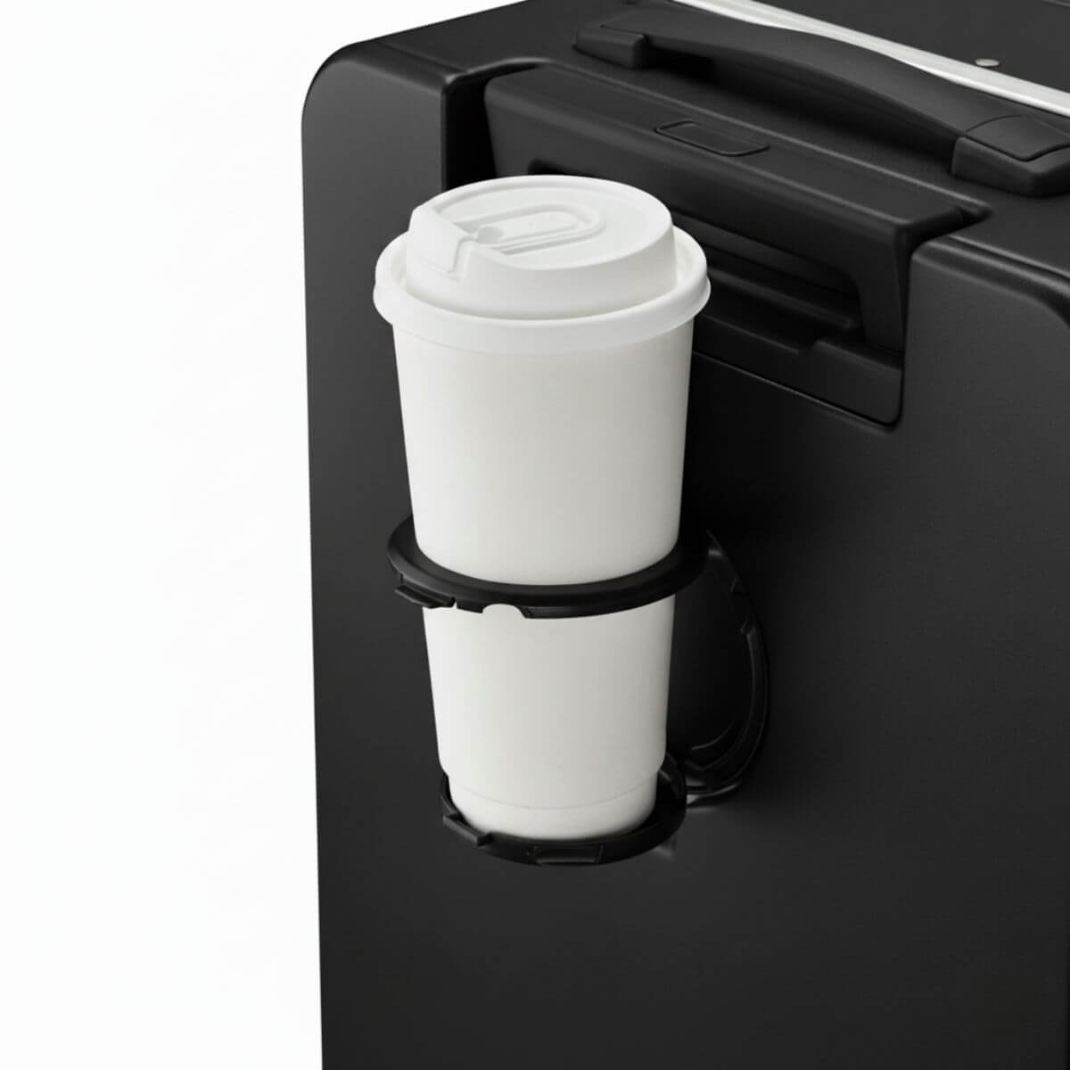 Black suitcase with a cup holder holding a white cup.