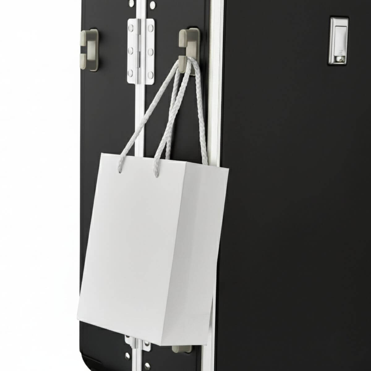 Side hook design on Nordiva Classic black suitcase holding a shopping bag