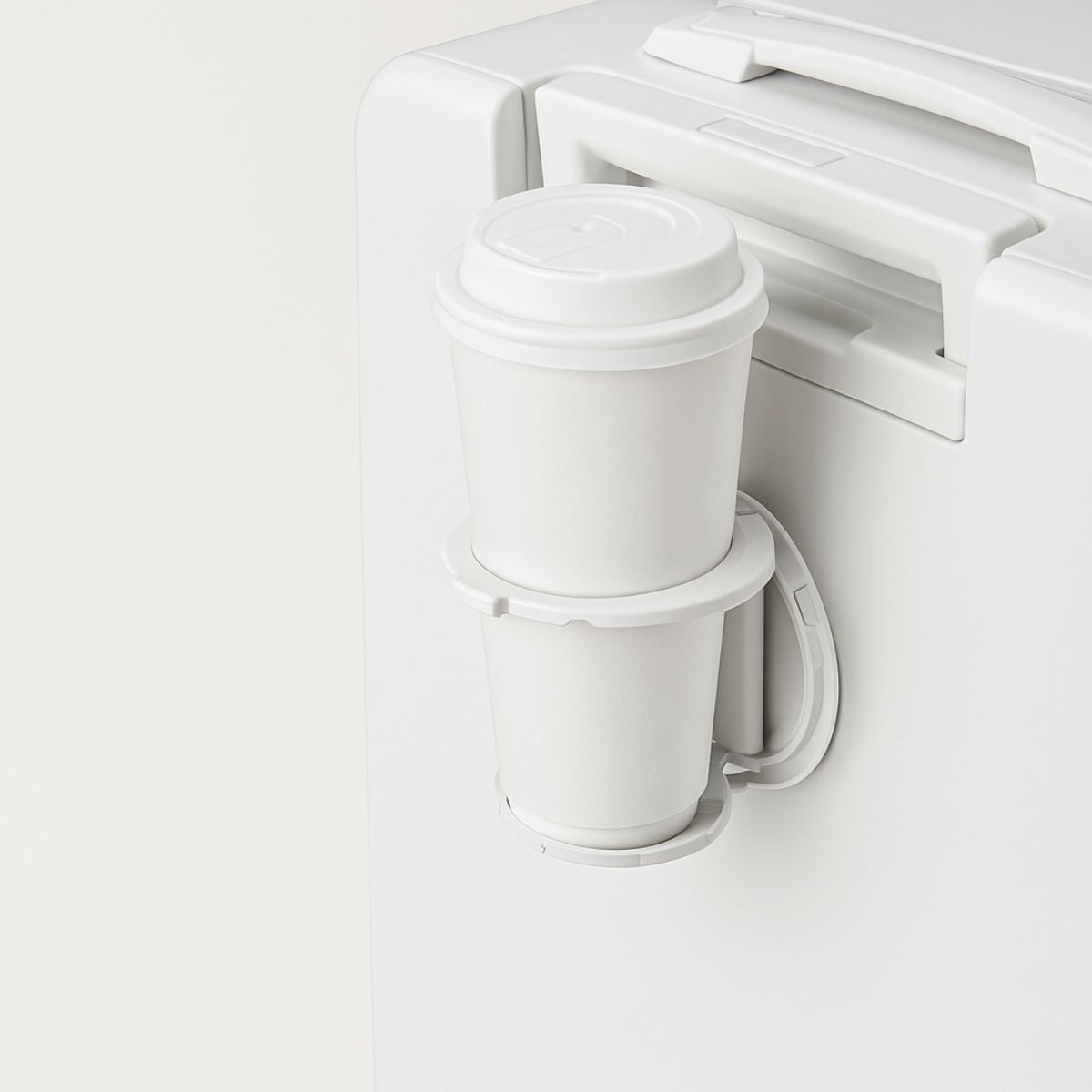 White coffee maker with two white cups on a white background