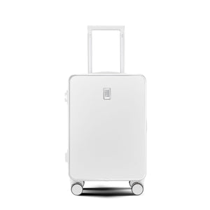 White hard shell suitcase with minimalist front panel and top handle extended.