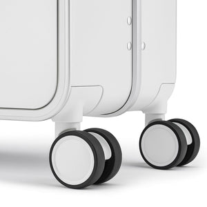 White suitcase dual spinner wheels with shock-absorbing TPE design.