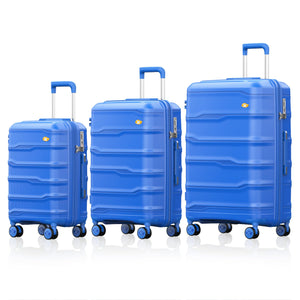 Three blue suitcases of different sizes on a white background