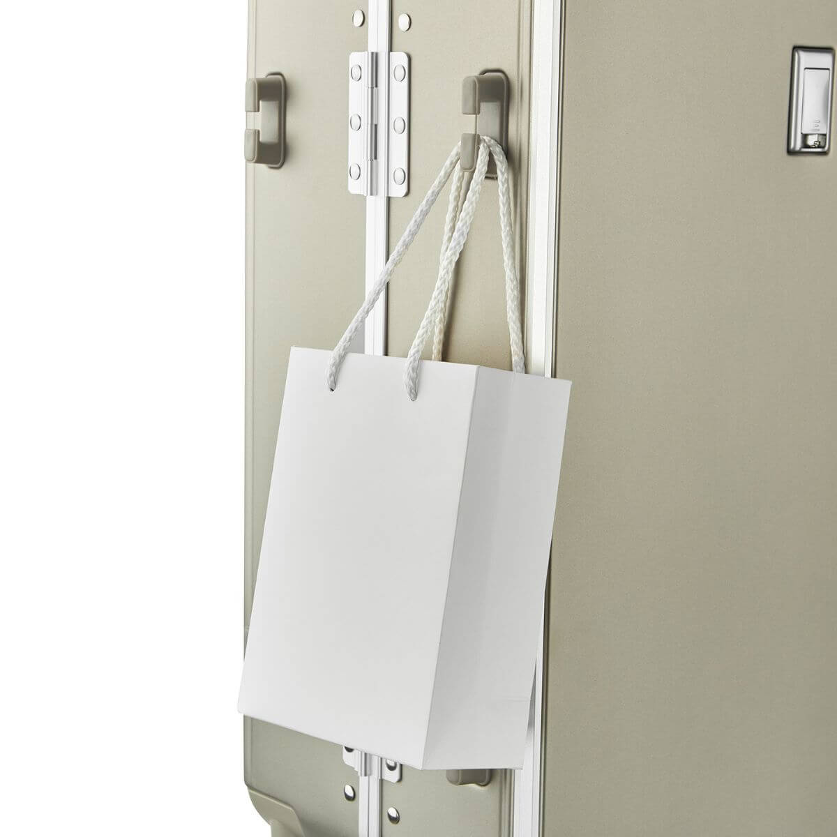 Side hook feature on Nordiva Classic Titanium Silver suitcase – convenient design for attaching shopping or handbags.