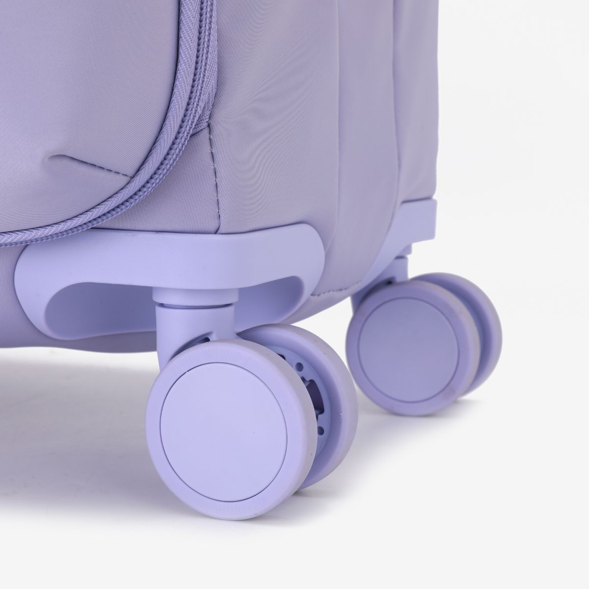 Urbaneo 76cm softside large check in suitcase — close-up of quiet 360 degree spinner wheels