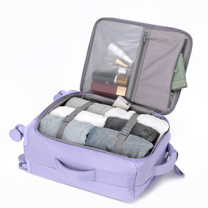 Urbaneo 64cm softside medium check in suitcase packed with clothing secured by compression straps